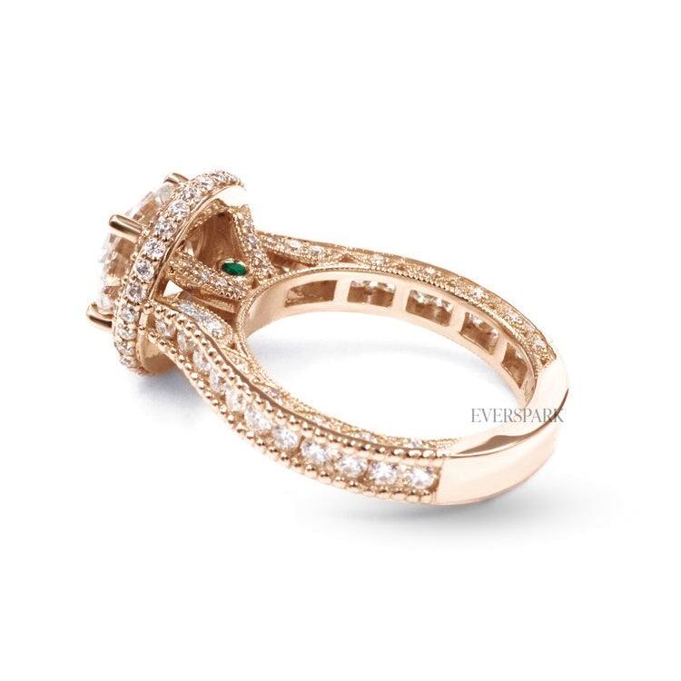 Pia Emerald Rose engagement ring - diagonal view from back - hand-cut Everspark Moissanite, cathedral setting, halo, pave sidestones, milgrain details, peekaboo sidestones, 7mm, 7.5mm, or 8mm round cut center stone, available in 18k White Gold, 18k Yellow Gold, 18k Rose Gold, Platinum 950, Blue Sapphire, Pink Sapphire, Ruby or Emerald sidestones, video: Pia Platinum with Blue Sapphire sidestones, 8mm center stone.