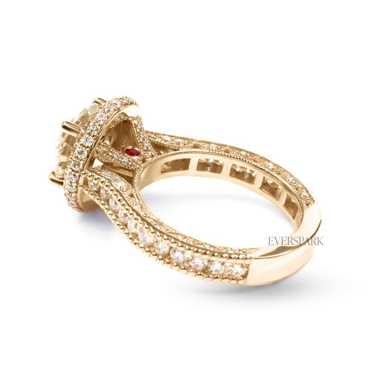 Pia Ruby Gold engagement ring - diagonal view from back - hand-cut Everspark Moissanite, cathedral setting, halo, pave sidestones, milgrain details, peekaboo sidestones, 7mm, 7.5mm, or 8mm round cut center stone, available in 18k White Gold, 18k Yellow Gold, 18k Rose Gold, Platinum 950, Blue Sapphire, Pink Sapphire, Ruby or Emerald sidestones, video: Pia Platinum with Blue Sapphire sidestones, 8mm center stone.