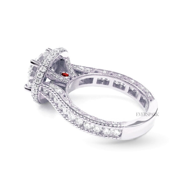 Pia Ruby Platinum engagement ring - side view - hand-cut Everspark Moissanite, cathedral setting, halo, pave sidestones, milgrain details, peekaboo sidestones, 7mm, 7.5mm, or 8mm round cut center stone, available in 18k White Gold, 18k Yellow Gold, 18k Rose Gold, Platinum 950, Blue Sapphire, Pink Sapphire, Ruby or Emerald sidestones, video: Pia Platinum with Blue Sapphire sidestones, 8mm center stone.